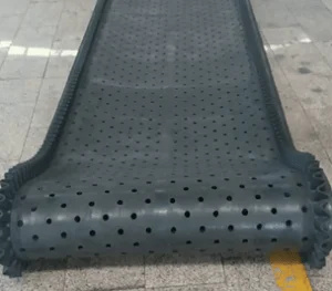 S-sidewall perforated rubber track for tumble shot blasting machines